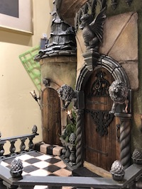 The doorway of the dragon house by Sandy Edwards featuring pineapples FN6 and Bazil the basilisk ST15